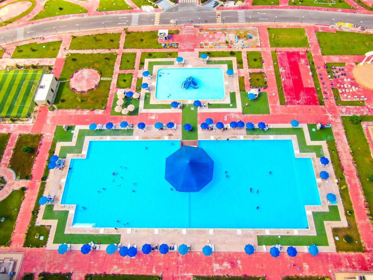 Tolip North Coast Hotel El Alamein Exterior photo Aerial view of the pool