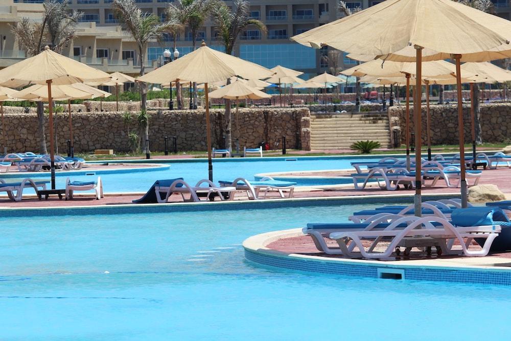 Tolip North Coast Hotel El Alamein Exterior photo A pool at a resort in Egypt